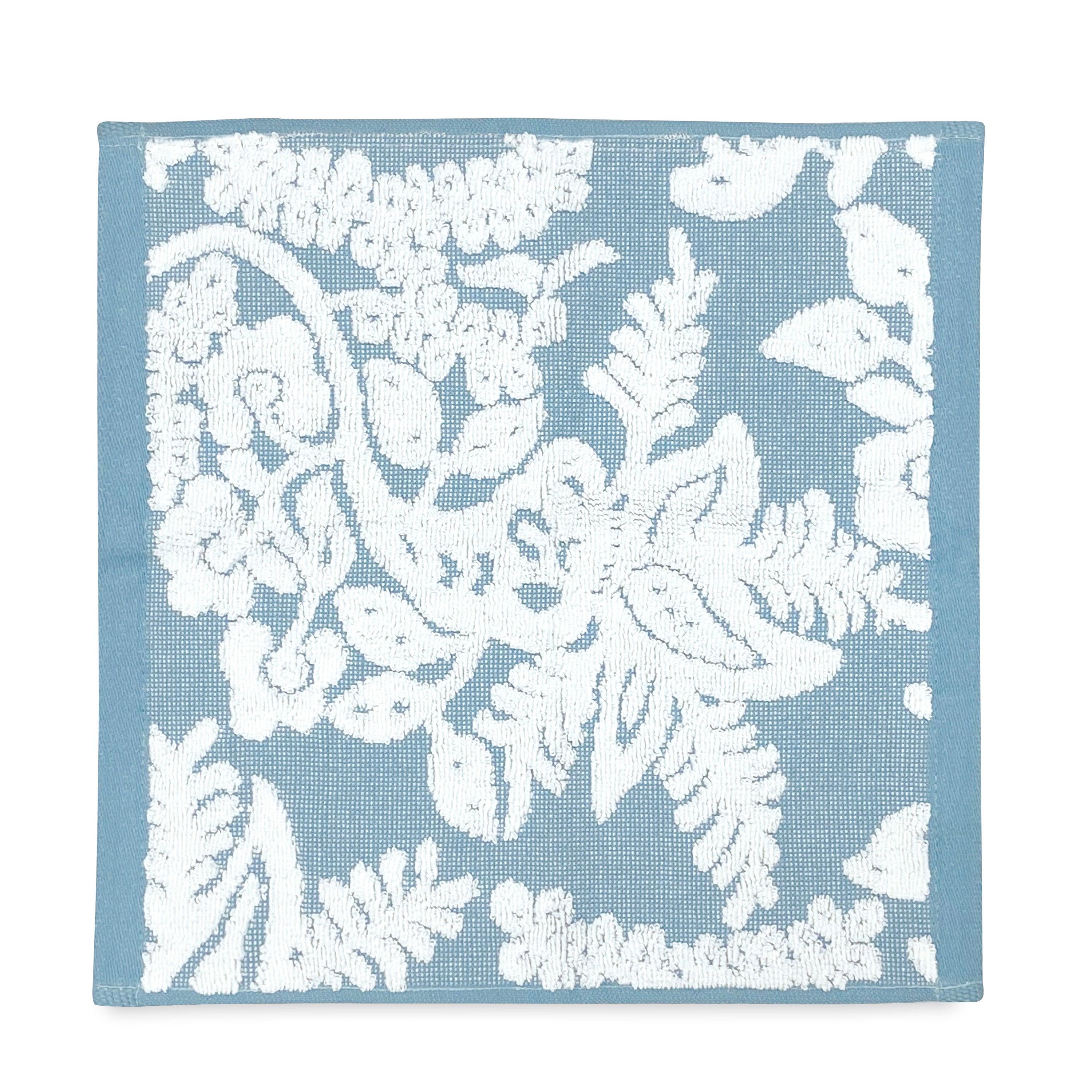 A John Robshaw blue and white Pasak Blue Bath Towel with an embroidered floral pattern.