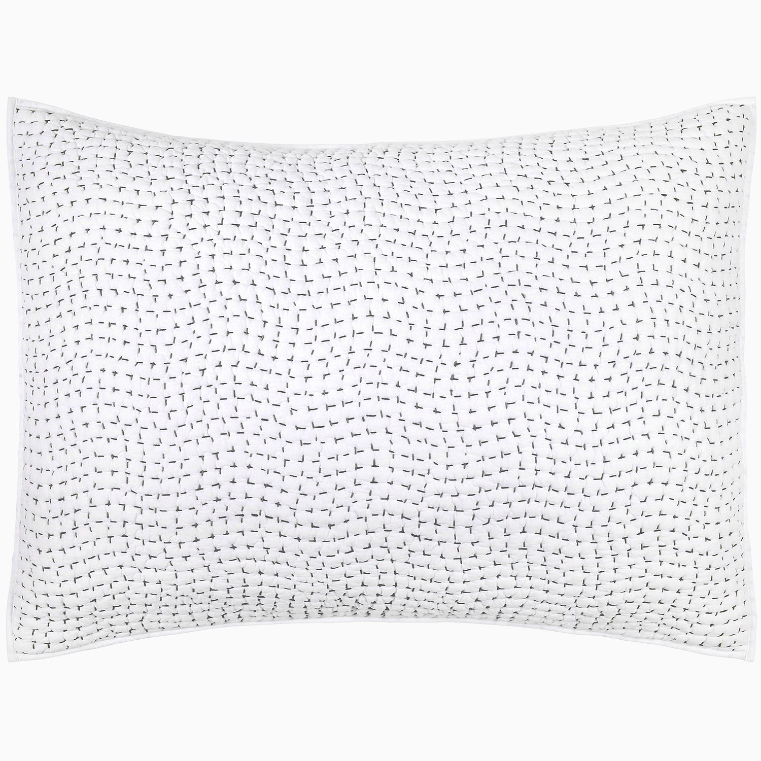 "A white pillow with dots on it, made from cotton voile coverlets and hand-stitched. The Organic Hand Stitched Gray Quilt, made by John Robshaw."