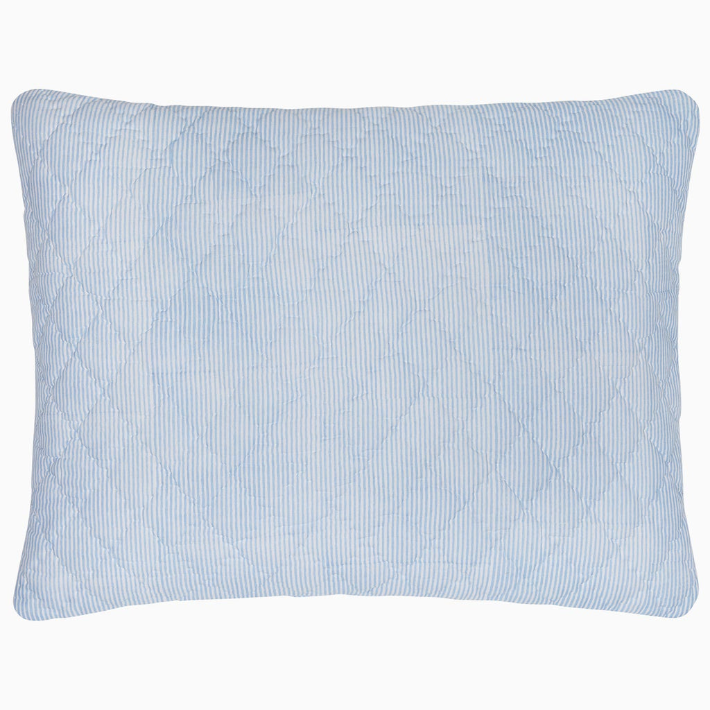 "A Nandi Light Indigo Quilted Pillow on a white background, made with cotton voile, by John Robshaw."