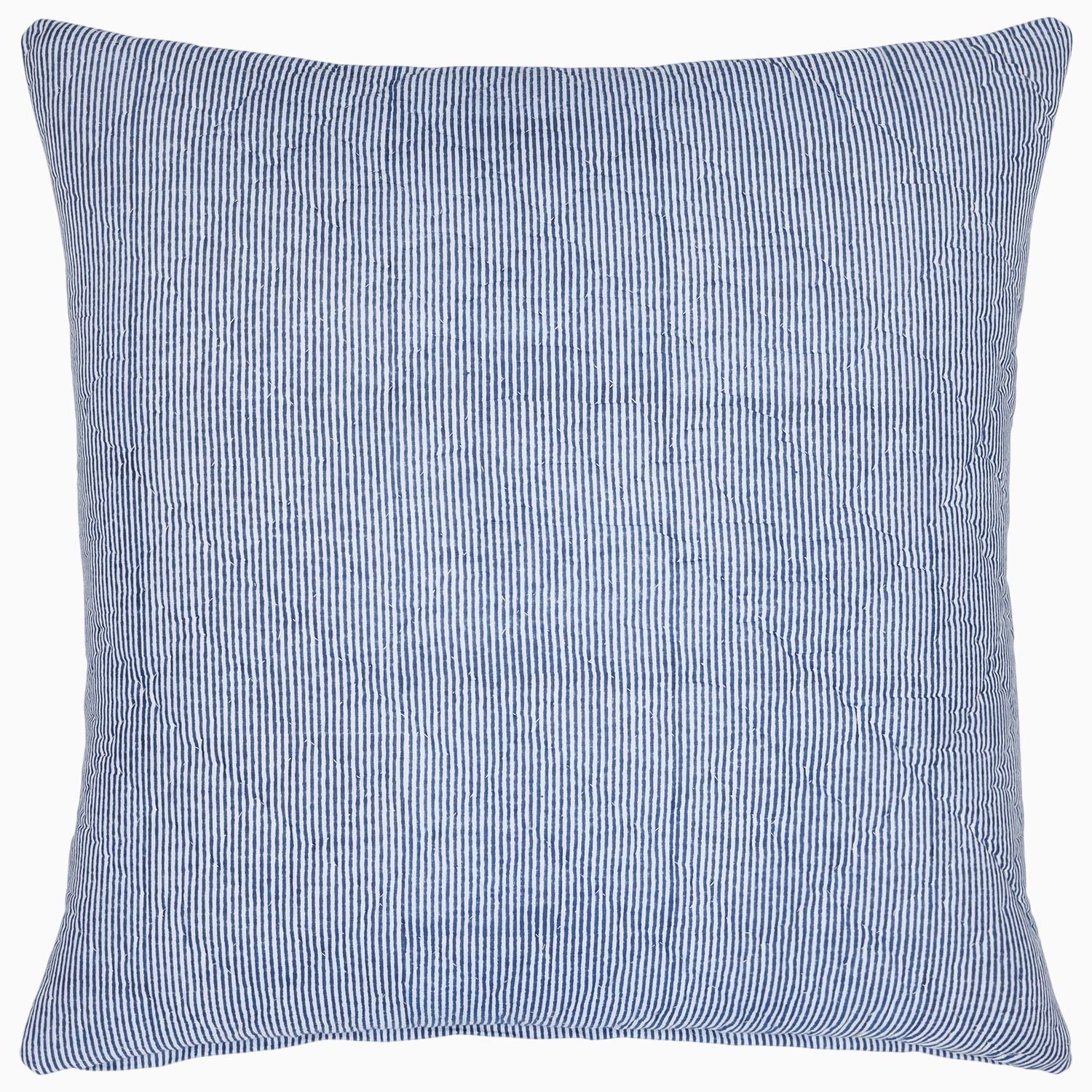 A simple striped Nandi Indigo Quilt pillow by John Robshaw.