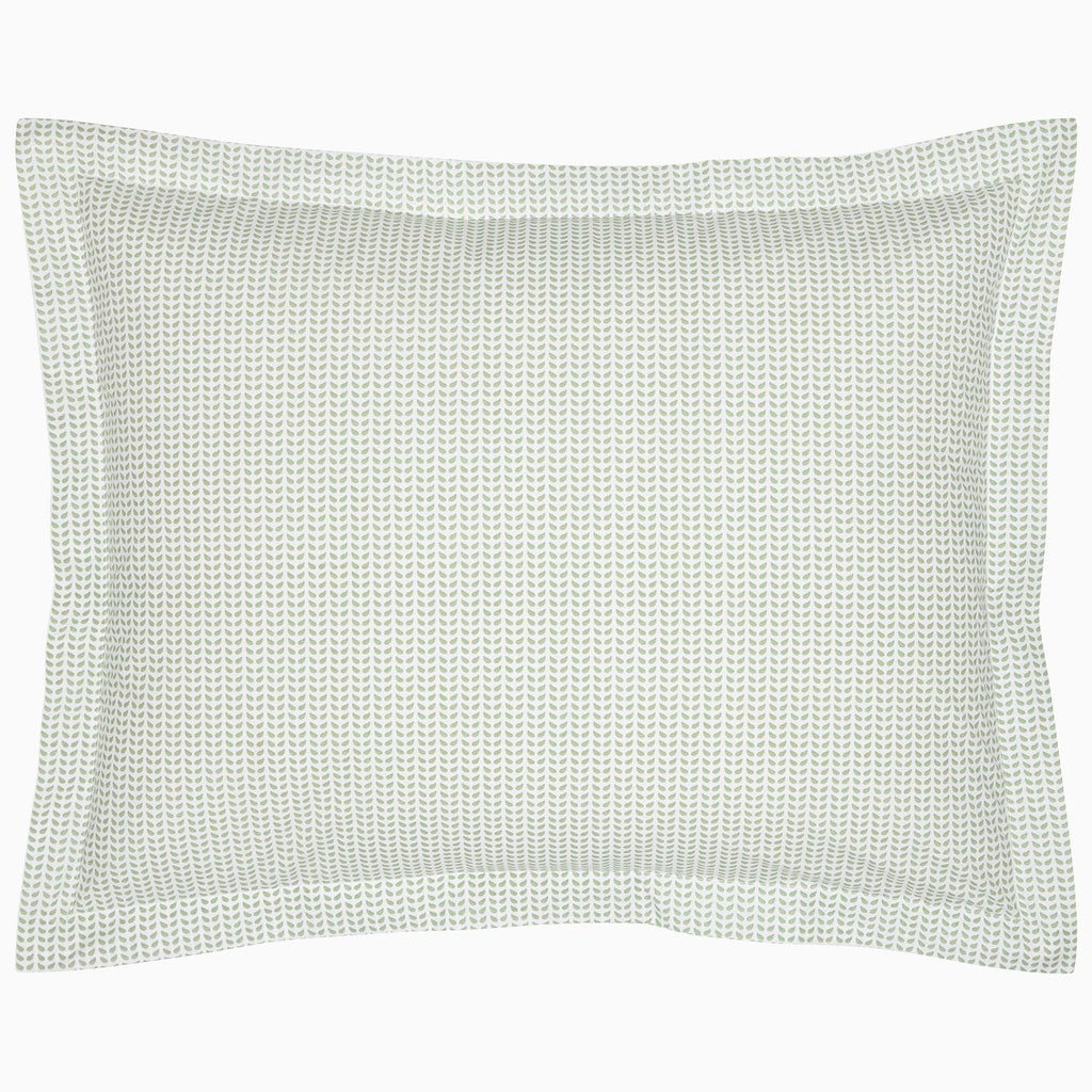 A John Robshaw Cinde Sage Organic Duvet with a green polka dot pillowcase on a white background.