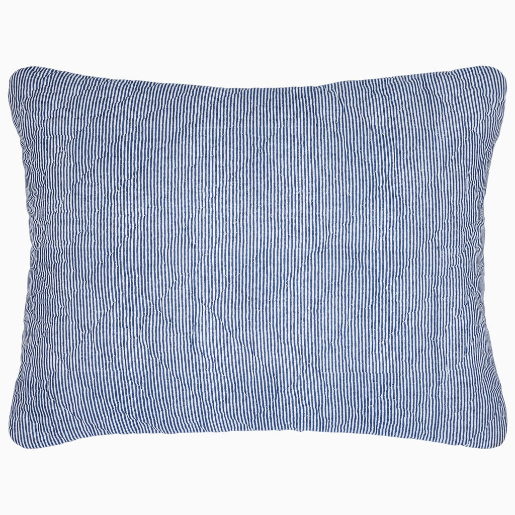 A Nandi Indigo Quilt pillow with simple stripes by John Robshaw.