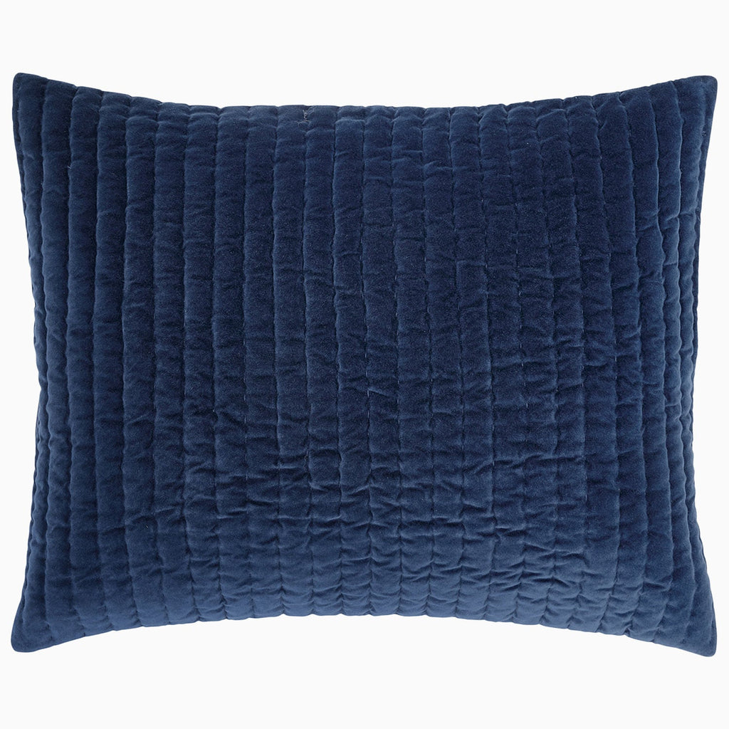 A Velvet Indigo Quilt hand quilted by Indian artisans on a white background by John Robshaw.