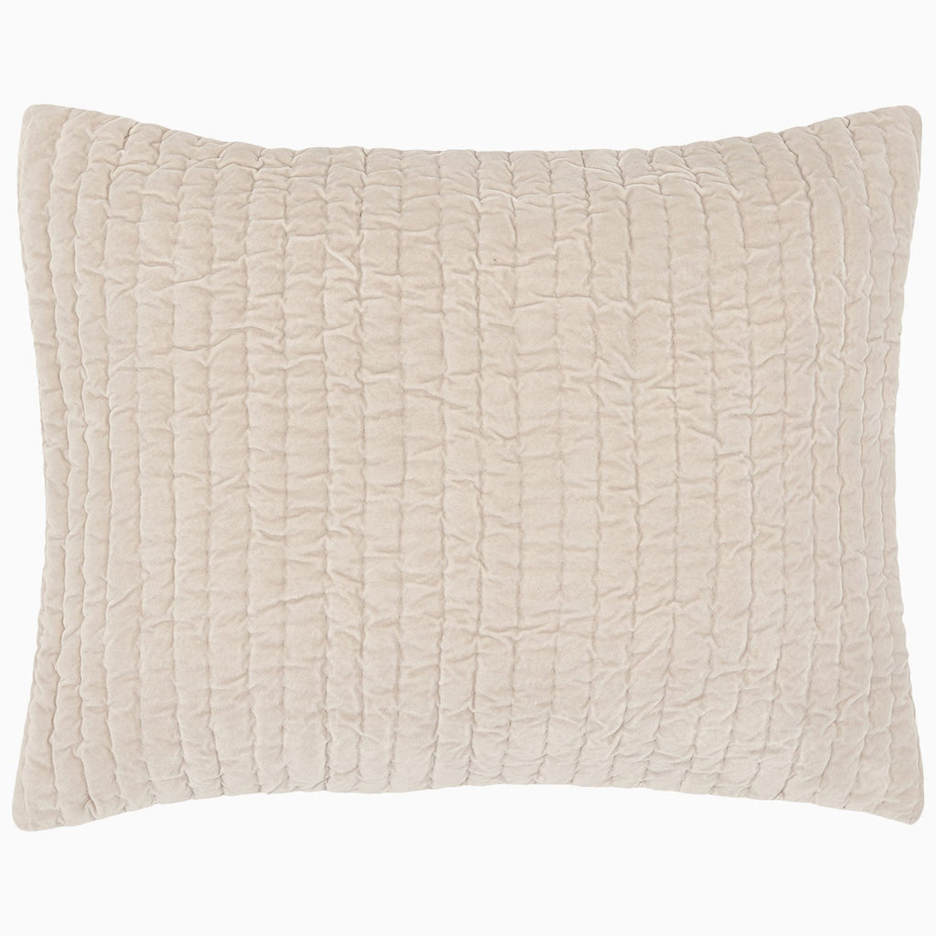 "A soft beige Velvet Sand Quilt pillow on a white background, hand quilted by John Robshaw."