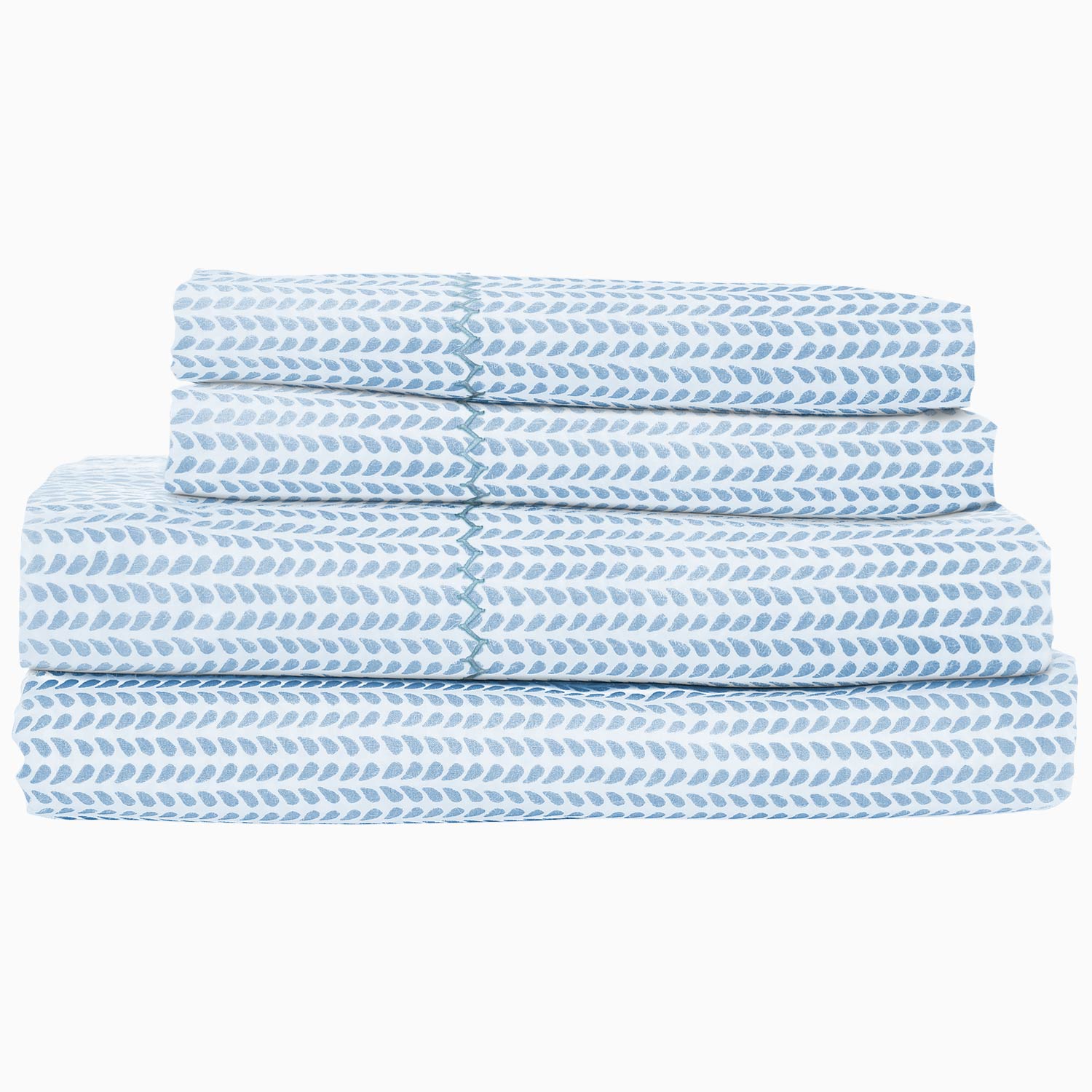 John Robshaw's Cinde Light Indigo Organic Sheet Set is a blue and white chevron sheet set made of 100% cotton percale.