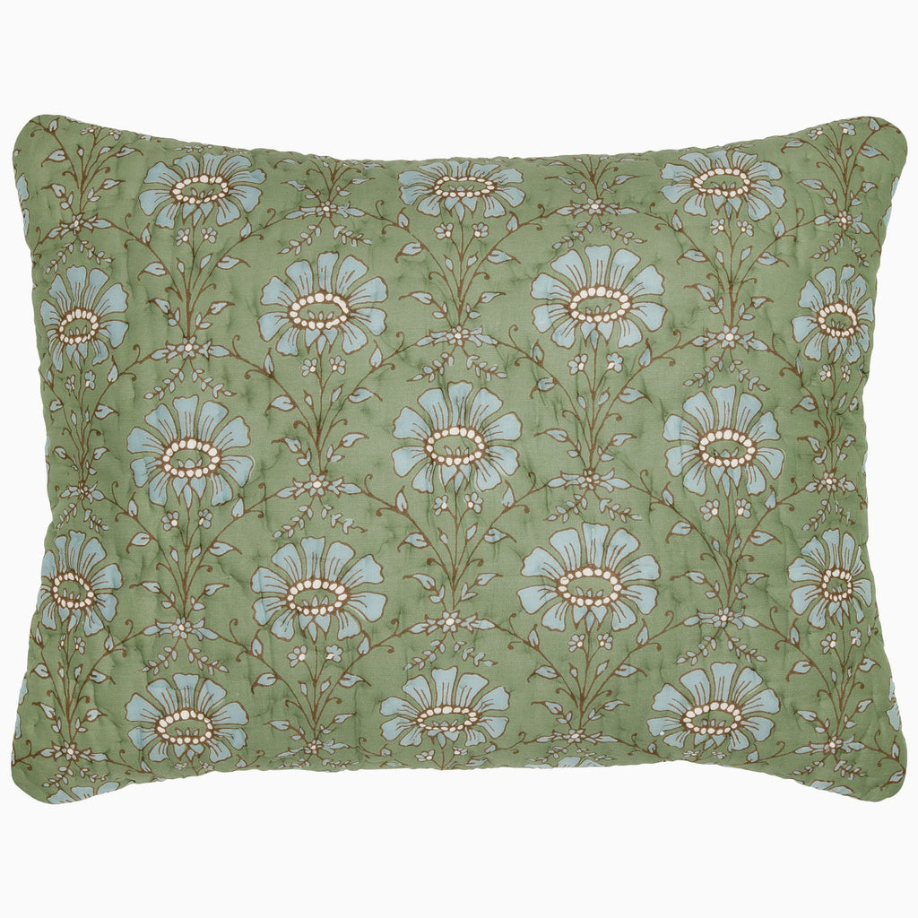 "The Jeeva Sage Quilt by John Robshaw is a rectangular pillow with a green background, featuring a pattern of large blue and white flowers with intricate stems and leaves, reminiscent of a spring meadow design. This soft cotton quilted piece is both charming and cozy."