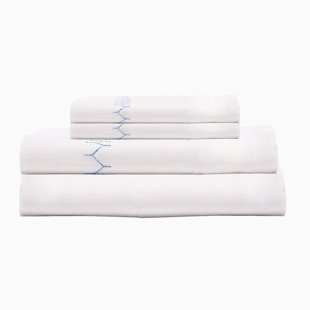 A Stitched Light Indigo Organic Sheets set by John Robshaw with blue lines and organic cotton percale.